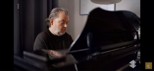 At the piano
